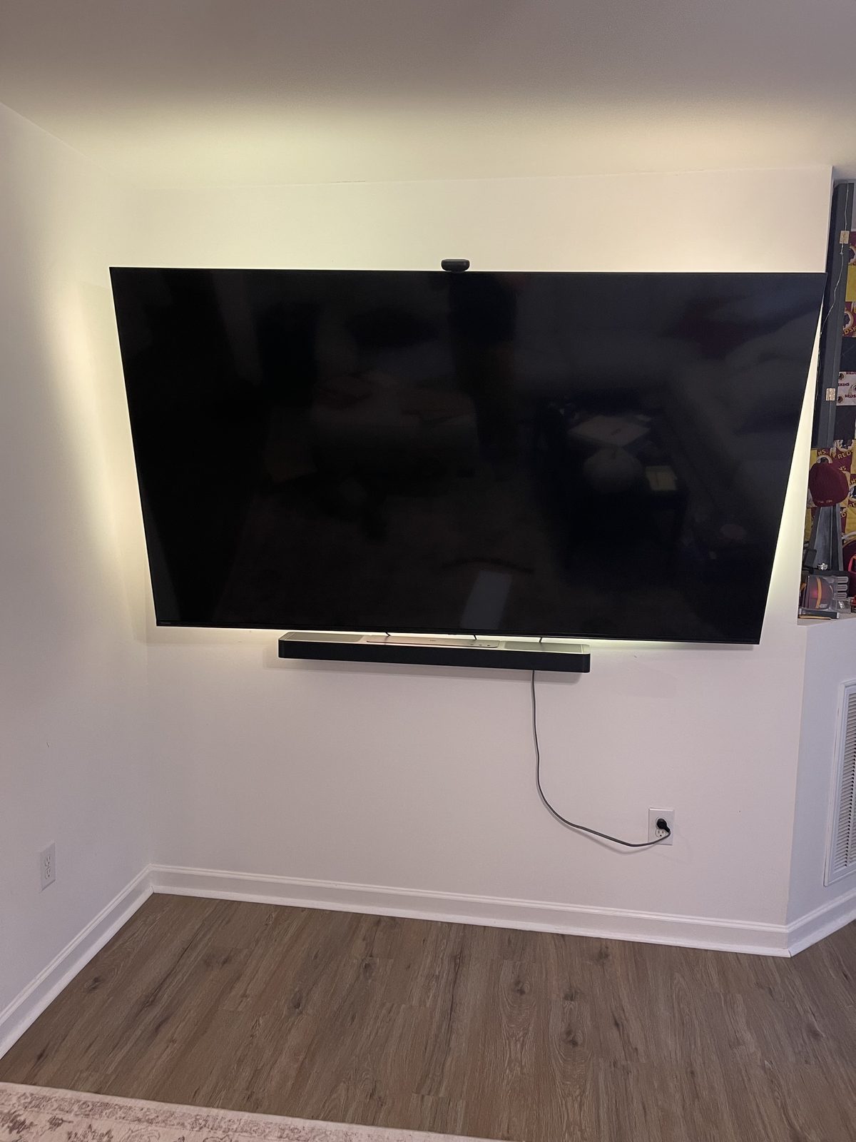 Large TV mount + soundbar install with clean cable run.